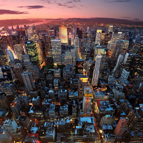 Aerial view of the Manhattan skyline at dusk.