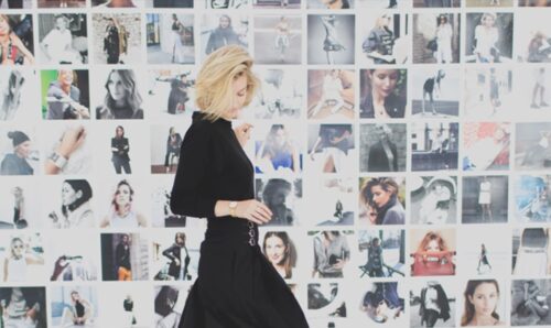 Stylekist Brand Image - Woman standing in front of a collage of photos